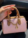 Pink and brown patterned handbag