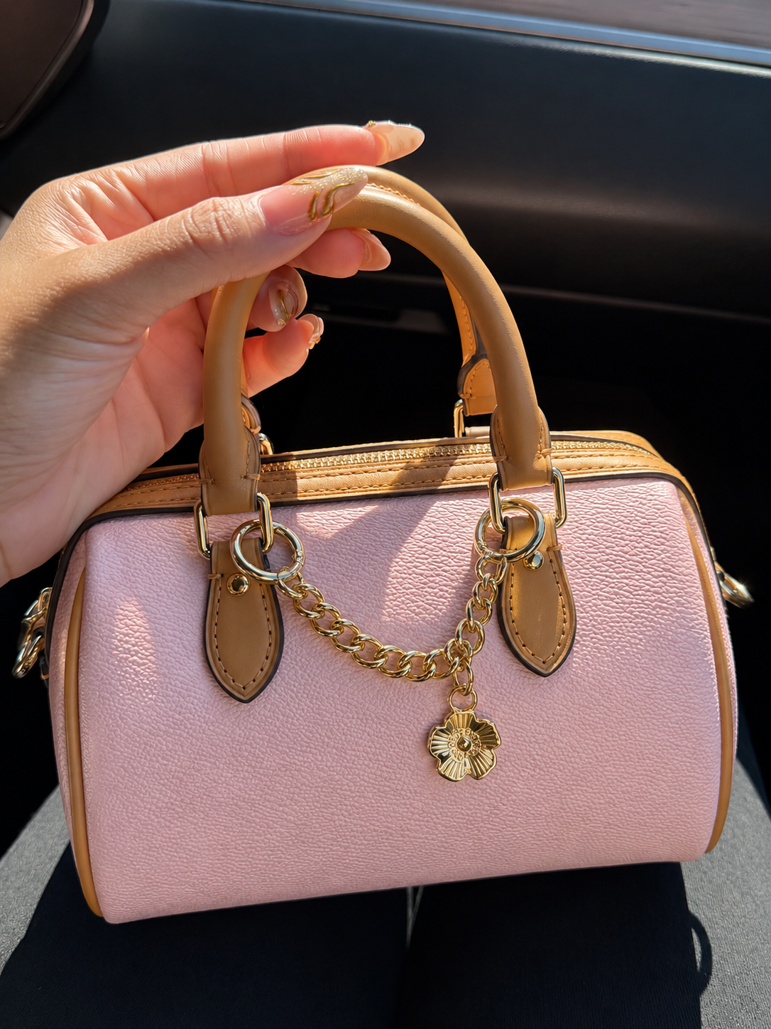 Pink and brown patterned handbag